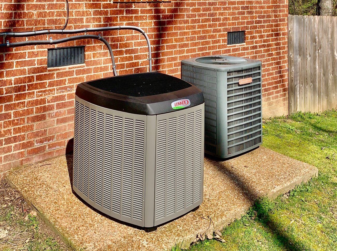 two hvac units outside a house