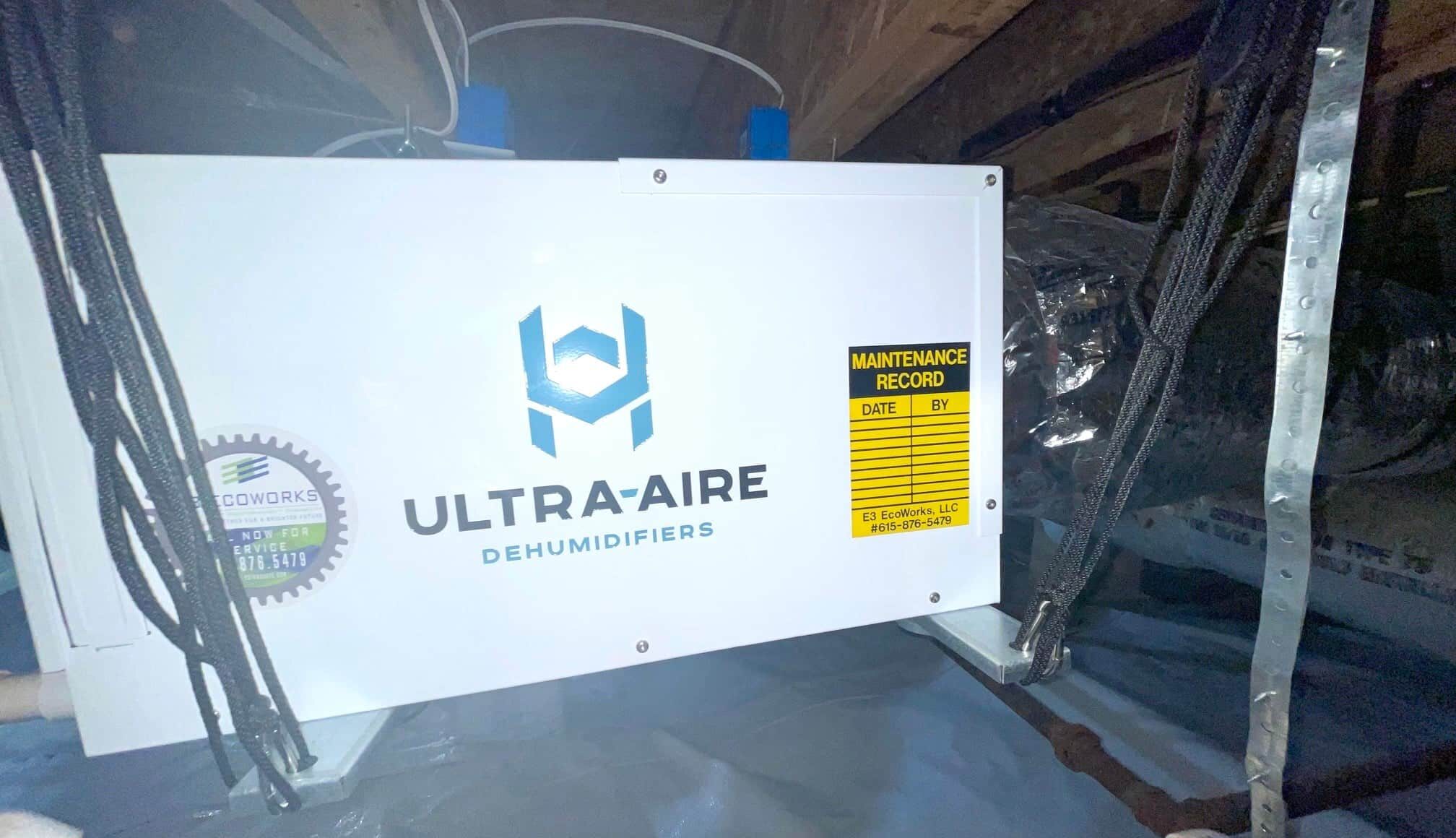 a whole home dehumidifier in an attic of a home