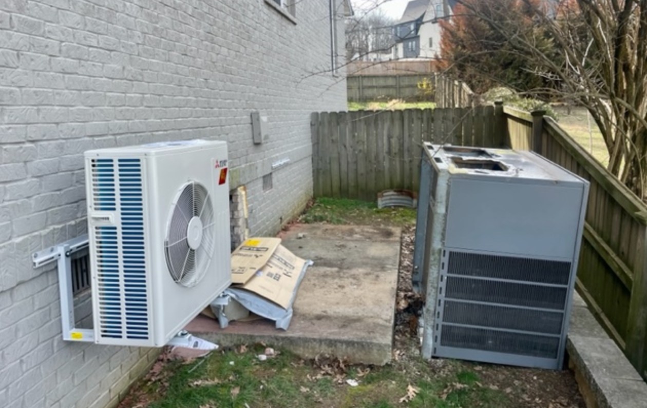 a new hvac unit next to the old one