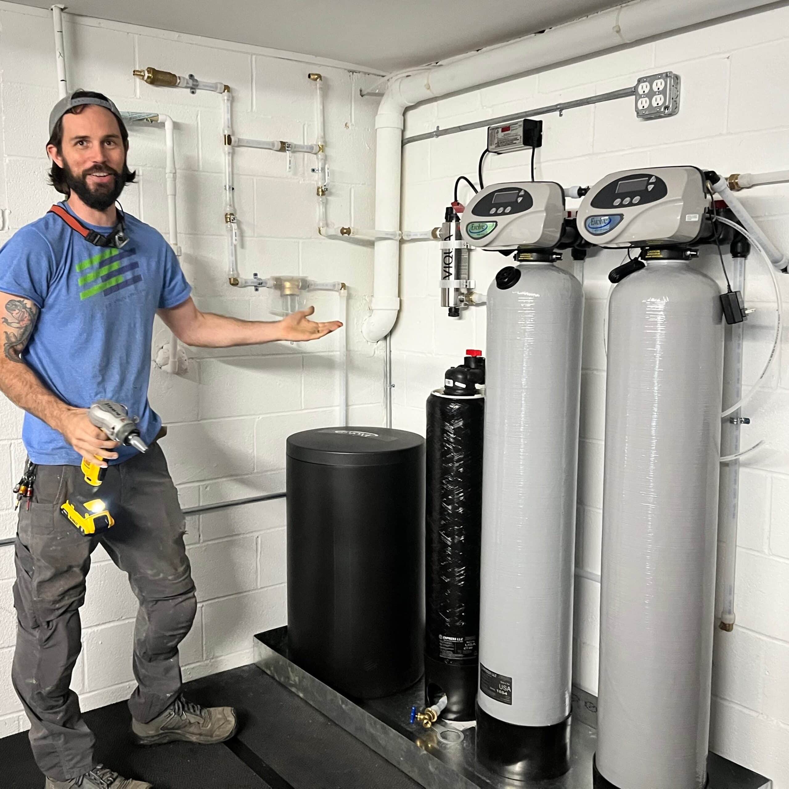 Employee, Nolan, with an installed water filtration system