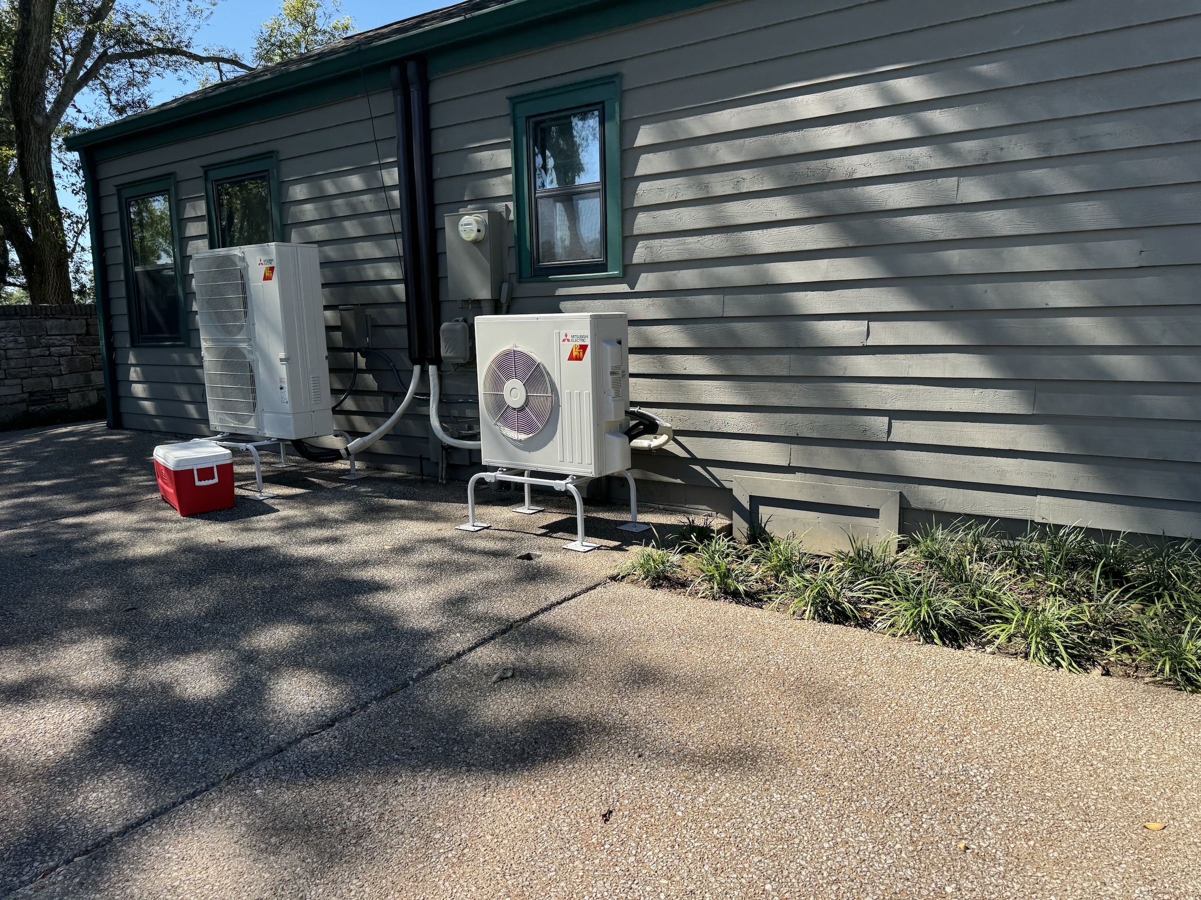 Newly Installed Heat Pumps on the side of a house