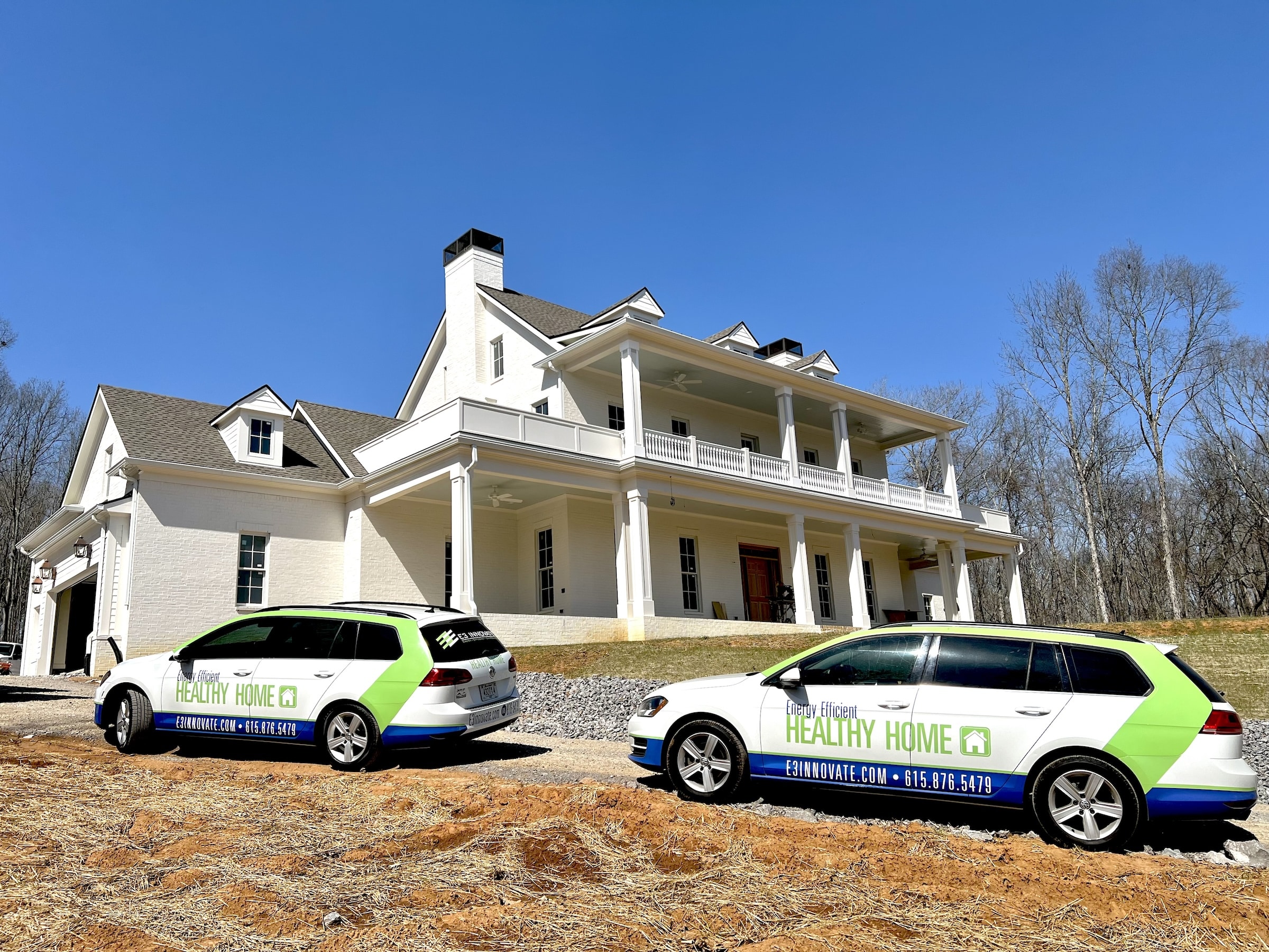 E3 Innovate Vehicles Parked In Front Of House