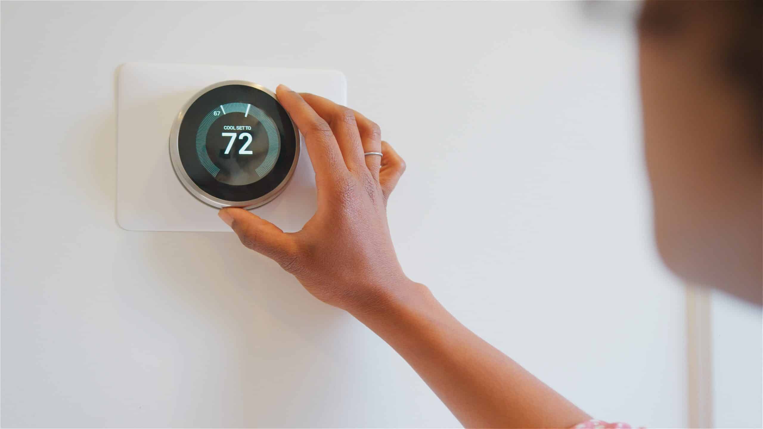 smart thermostat being controlled