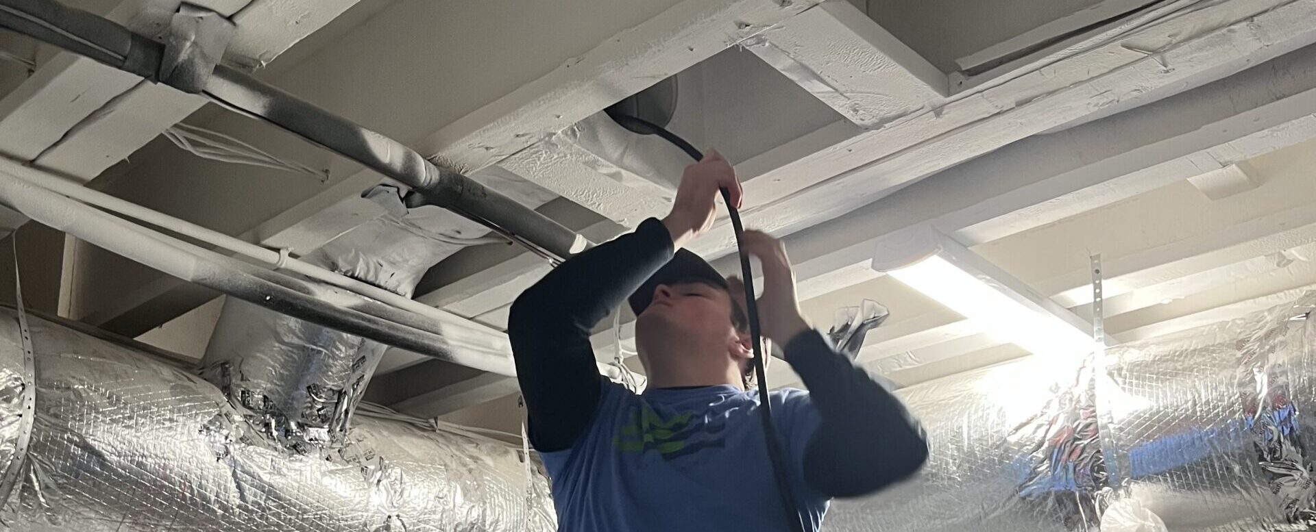 e3 innovate worker cleaning ducts